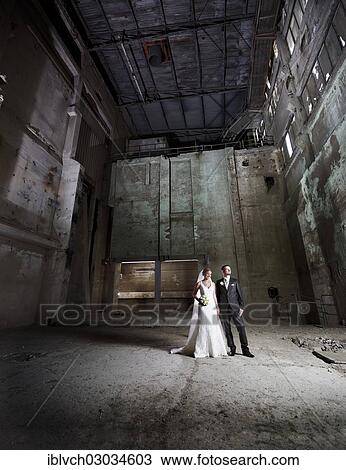 "Bride and groom standing in an old industrial building, Austria, Europe" View Large Photo Image Stock Image - "Bride and groom standing in an old industrial building, Austria, Europe". Fotosearch