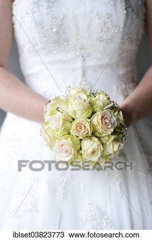 Bride holding a bridal bouquet View Large Photo Image Stock Image - Bride holding a bridal bouquet. Fotosearch