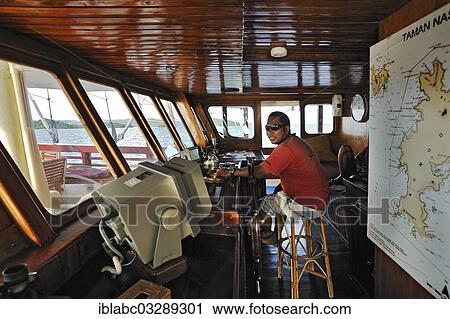 Stock Image - "Bridge, Buginese Schooner, Seven Seas Liveaboard, Dampier Strait, West Papua, Indonesia, Asia". Fotosearch
