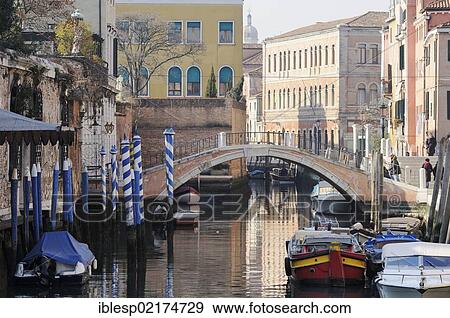 Stock Photo - "Bridge, houses along a canal, Rio dei Ognissanti, Dorsoduro, Venice, Venezia, Veneto, Italy, Europe". Fotosearch
