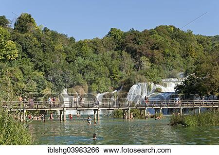 "Bridge in front of a waterfall, Krka National Park, Dalmatia, Croatia, Europe" View Large Photo Image Stock Photograph - "Bridge in front of a waterfall, Krka National Park, Dalmatia, Croatia, Europe". Fotosearch