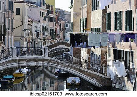 "Bridge over Rio de Sant'Ana, washing hanging on washing lines, houses along a canal, Castello, Venice, Venezia, Veneto, Italy, Europe" View Large Photo Image Stock Image - "Bridge over Rio de Sant'Ana, washing hanging on washing lines, houses along a canal, Castello, Venice, Venezia, Veneto, Italy, Europe". Fotosearch