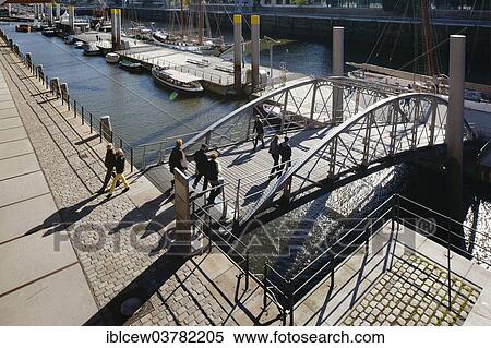 "Bridge to the pontoon of the Traditional Ship Harbor with historic sailing ships, Sandtorhafen, Sandtorkai, HafenCity, Hamburg, Germany, Europe" View Large Photo Image Stock Photography - "Bridge to the pontoon of the Traditional Ship Harbor with historic sailing ships, Sandtorhafen, Sandtorkai, HafenCity, Hamburg, Germany, Europe". Fotosearch
