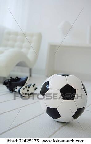 Bright living room with a football at the front View Large Photo Image Stock Photography - Bright living room with a football at the front. Fotosearch
