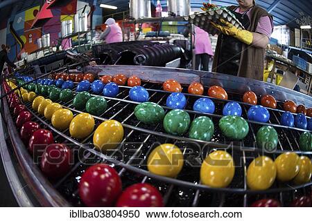 "Brightly coloured Easter eggs on a conveyor belt, Beham egg dyeing company, Thannhausen, Bayern, Germany, Europe" View Large Photo Image Stock Image - "Brightly coloured Easter eggs on a conveyor belt, Beham egg dyeing company, Thannhausen, Bayern, Germany, Europe". Fotosearch