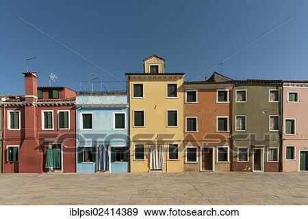 Brightly painted houses, Piazza Baldassarre Galuppi, Burano, Venice, Veneto, Italy, Europe View Large Photo Image Stock Photo - Brightly painted houses, Piazza Baldassarre Galuppi, Burano, Venice, Veneto, Italy, Europe. Fotosearch