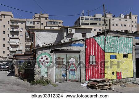 Picture - "Brightly painted huts in front of modern residential buildings, historic quarter of Borg Vecchio, Palermo, Province of Palermo, Sicily, Italy, Europe". Fotosearch