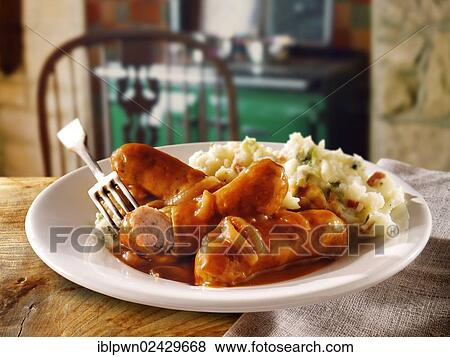 Stock Photo - "British Food, Lincolnshire sausages, onion gravy and mashed potatoes". Fotosearch