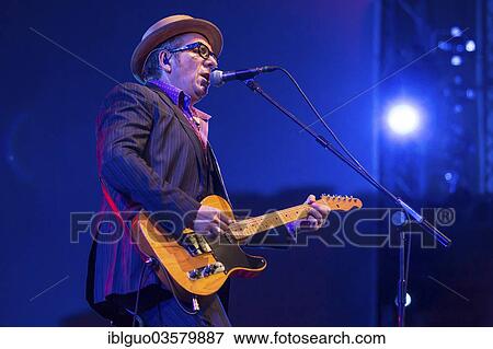"British singer-songwriter Elvis Costello, performing live at the Blue Balls Festival, Luzerner Saal KKL concert hall, Luzern, Canton of Lucerne, Switzerland, Europe" View Large Photo Image Stock Photo - "British singer-songwriter Elvis Costello, performing live at the Blue Balls Festival, Luzerner Saal KKL concert hall, Luzern, Canton of Lucerne, Switzerland, Europe". Fotosearch
