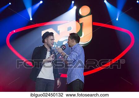 "British singer-songwriter Oliver Stanley, alias Olly Murs, performing live at Energy Stars For Free in Hallenstadion, with host Simon Moser, Zurich, Switzerland, Europe" View Large Photo Image Stock Image - "British singer-songwriter Oliver Stanley, alias Olly Murs, performing live at Energy Stars For Free in Hallenstadion, with host Simon Moser, Zurich, Switzerland, Europe". Fotosearch