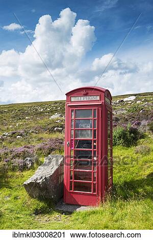 Stock Image - "British telephone box in the Scottish Highlands, Northern Highlands, Highlands, Sutherland County, Highland, Scotland, United Kingdom, Europe". Fotosearch