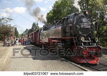 "Brockenbahn steam train with tourists boarding, Drei Annen Hohne, Wernigerode, Saxony-Anhalt, Germany, Europe" View Large Photo Image Stock Photo - "Brockenbahn steam train with tourists boarding, Drei Annen Hohne, Wernigerode, Saxony-Anhalt, Germany, Europe". Fotosearch