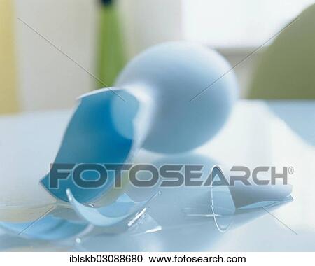Broken blue vase lying on a glass table View Large Photo Image Stock Image - Broken blue vase lying on a glass table. Fotosearch
