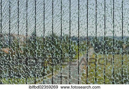 "Broken glass of a safety screen along a road crossing a bridge, Dresden, Saxony, Germany, Europe" View Large Photo Image Stock Photo - "Broken glass of a safety screen along a road crossing a bridge, Dresden, Saxony, Germany, Europe". Fotosearch