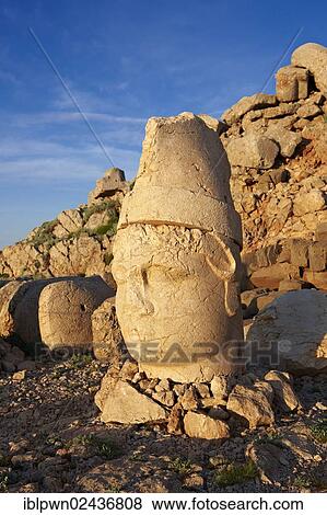 Stock Photo - "Broken statues around the tomb of Commagene King Antiochus 1 on top of Mount Nemrut, Turkey, Asia". Fotosearch