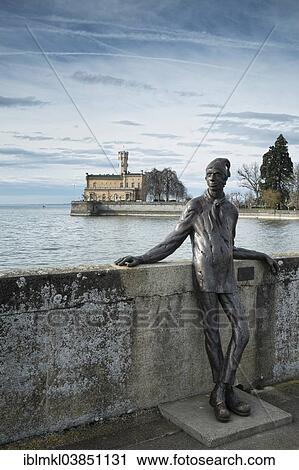 "Bronze figure of a former dock worker at the pier, Schloss Montfort Castle on the shore of Lake Constance, Langenargen, Baden-Wurttemberg, Germany, Europe" View Large Photo Image Stock Image - "Bronze figure of a former dock worker at the pier, Schloss Montfort Castle on the shore of Lake Constance, Langenargen, Baden-Wurttemberg, Germany, Europe". Fotosearch