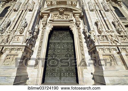 Stock Image - "Bronze main door with scenes from the life of Mary, sculptor Lodovico Pogliaghi, west facade of Milan Cathedral or Duomo di Santa Maria nascente, Milan, Lombardy, Italy, Europe". Fotosearch