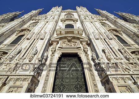 Stock Image - "Bronze main door with scenes from the life of Mary, sculptor Lodovico Pogliaghi, west facade of Milan Cathedral or Duomo di Santa Maria Nascente, Milan, Lombardy, Italy, Europe". Fotosearch