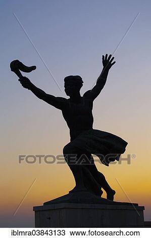 Stock Image - "Bronze sculpture, """"Flame of Freedom"""", at sunset, Citadel, Gellert Hill, Budapest, Hungary, Europe". Fotosearch