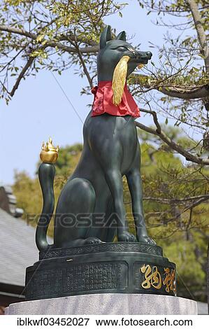"Bronze statue, fox god with golden rice ears and a flame on the tip of its tail, Fushimi Inari Taisha Shinto shrine, Fushimi, Kyoto, Kinki region, Japan, Asia" View Large Photo Image Stock Photo - "Bronze statue, fox god with golden rice ears and a flame on the tip of its tail, Fushimi Inari Taisha Shinto shrine, Fushimi, Kyoto, Kinki region, Japan, Asia". Fotosearch