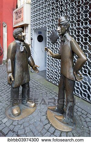 "Bronze statue of the Cologne originals """"Tunnes"""" and """"Schal"""", historic centre, Cologne, North Rhine-Westphalia, Germany, Europe" View Large Photo Image Stock Image - "Bronze statue of the Cologne originals """"Tunnes"""" and """"Schal"""", historic centre, Cologne, North Rhine-Westphalia, Germany, Europe". Fotosearch