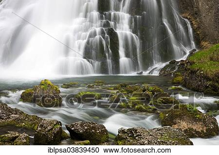 Stock Image - "Brook with moss-covered stones, Golling Waterfall, Salzburg, AustriaSteinen". Fotosearch