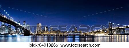 Stock Photography - "Brooklyn Bridge and Manhattan Bridge, view from Main Street Park on the East River onto the Manhattan skyline, Downtown Brooklyn, Brooklyn, New York". Fotosearch