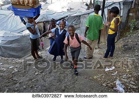 "Brother and sister in school uniform on the way to school, Camp Icare for earthquake refugees, Fort National, Port-au-Prince, Haiti, North America" View Large Photo Image Stock Photo - "Brother and sister in school uniform on the way to school, Camp Icare for earthquake refugees, Fort National, Port-au-Prince, Haiti, North America". Fotosearch