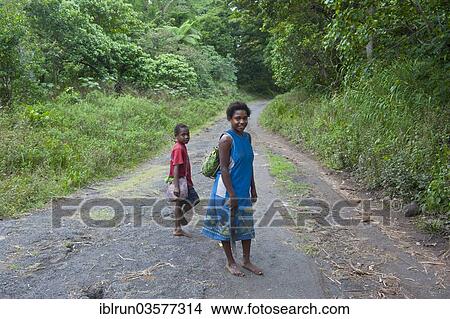 "Brother and sister on their way home, Tanna, Vanuatu, Oceania" View Large Photo Image Picture - "Brother and sister on their way home, Tanna, Vanuatu, Oceania". Fotosearch