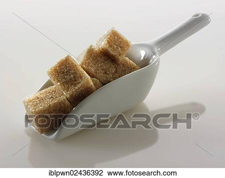 Stock Image - "Brown Demerara sugar, sugar cubes". Fotosearch