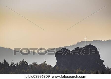 "Bruchhauser Steine rocks with a group of visitors at the summit cross, backlit, Olsberg, Sauerland, North Rhine-Westphalia, Germany, Europe" View Large Photo Image Stock Photo - "Bruchhauser Steine rocks with a group of visitors at the summit cross, backlit, Olsberg, Sauerland, North Rhine-Westphalia, Germany, Europe". Fotosearch