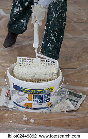 Bucket of paint and a paint roller for painting the walls View Large Photo Image Stock Image - Bucket of paint and a paint roller for painting the walls. Fotosearch