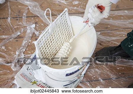 Bucket of paint with a paint roller for painting the walls View Large Photo Image Stock Image - Bucket of paint with a paint roller for painting the walls. Fotosearch