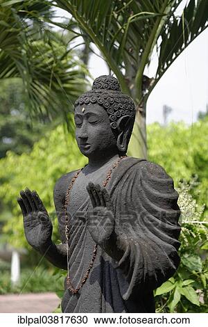 Stock Image - "Buddha sculpture, Vihara Maha Mojopahit, Mojokerto, Java, Indonesia, Asia". Fotosearch