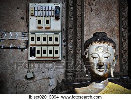 "Buddha statue and electrical installations in front of the Lao National Museum in Vientiane, Laos, Southeast Asia, Asia" View Large Photo Image Picture - "Buddha statue and electrical installations in front of the Lao National Museum in Vientiane, Laos, Southeast Asia, Asia". Fotosearch