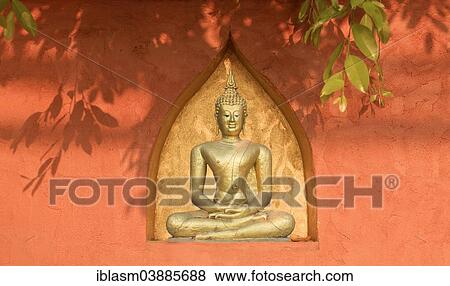 Stock Photo - "Buddha statue in a wall, Chiang Mai, Chiang Mai Province, Thailand, Asia". Fotosearch
