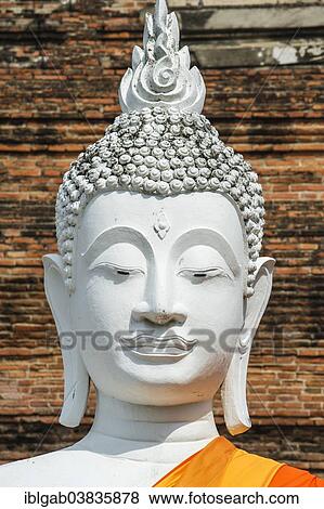 Stock Photo - "Buddha statue in front of the stupa at Wat Yai Chai Mongkhon, Ayutthaya, Thailand, Asia". Fotosearch