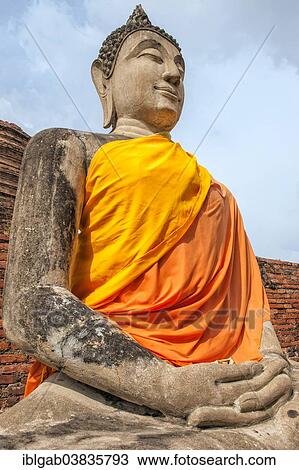 Stock Image - "Buddha statue next to the central stupa, Wat Yai Chai Mongkhon, Ayutthaya, Thailand, Asia". Fotosearch