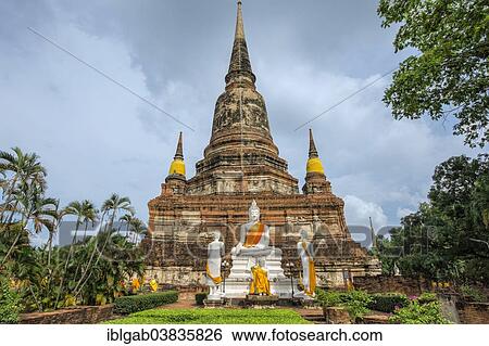 Stock Photograph - "Buddha statues in front of the stupa at Wat Yai Chai Mongkhon, Ayutthaya, Thailand, Asia". Fotosearch