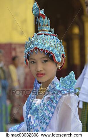 "Buddhist girl dressed up to celebrate the novitiation ceremony, Mahamuni Pagoda, Mandalay, Mandalay, Myanmar, Burma, Asia" View Large Photo Image Stock Photo - "Buddhist girl dressed up to celebrate the novitiation ceremony, Mahamuni Pagoda, Mandalay, Mandalay, Myanmar, Burma, Asia". Fotosearch
