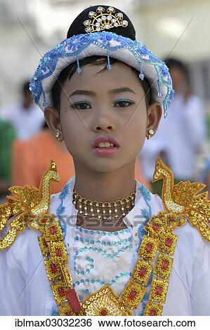 "Buddhist girl dressed up to celebrate the novitiation ceremony, Mahamuni Pagoda, Mandalay, Mandalay, Myanmar, Burma, Asia" View Large Photo Image Stock Photograph - "Buddhist girl dressed up to celebrate the novitiation ceremony, Mahamuni Pagoda, Mandalay, Mandalay, Myanmar, Burma, Asia". Fotosearch