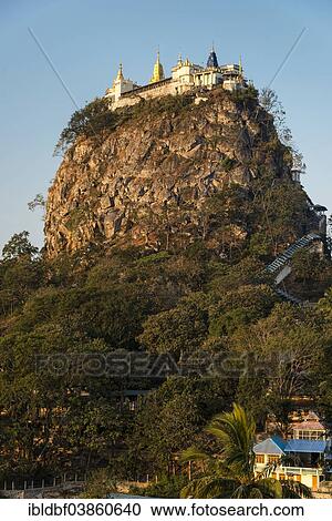 "Buddhist monastery, gilded Tuyin Taung Pagoda on the Taung Kalat volcanic cone, Mount Popa, Mandalay Region, Myanmar, Asia" View Large Photo Image Stock Image - "Buddhist monastery, gilded Tuyin Taung Pagoda on the Taung Kalat volcanic cone, Mount Popa, Mandalay Region, Myanmar, Asia". Fotosearch