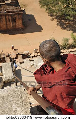 "Buddhist monk during the descent from Shwesandaw Pagoda, Bagan, Myanmar, Burma, Asia" View Large Photo Image Stock Photo - "Buddhist monk during the descent from Shwesandaw Pagoda, Bagan, Myanmar, Burma, Asia". Fotosearch
