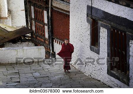 Stock Image - "Buddhist monk in Trongsa Dzong fortress, Trongsa, Trongsa District, Bhutan, Asia". Fotosearch