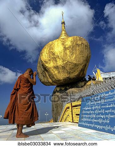 "Buddhist Monk praying in front of the Golden Rock or Kyaiktiyo Pagoda, Kyaikto, Mon-Staat, Myanmar, Burma, Asia" View Large Photo Image Picture - "Buddhist Monk praying in front of the Golden Rock or Kyaiktiyo Pagoda, Kyaikto, Mon-Staat, Myanmar, Burma, Asia". Fotosearch