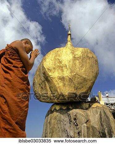 "Buddhist Monk praying in front of the Golden Rock or Kyaiktiyo Pagoda, Kyaikto, Mon-Staat, Myanmar, Burma, Asia" View Large Photo Image Stock Photography - "Buddhist Monk praying in front of the Golden Rock or Kyaiktiyo Pagoda, Kyaikto, Mon-Staat, Myanmar, Burma, Asia". Fotosearch
