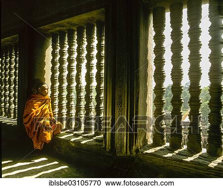 "Buddhist monk sitting at a baluster window in the temple of Angkor Wat, UNESCO World Cultural Heritage Site, Siem Reap, Siem Reap Province, Cambodia, Asia" View Large Photo Image Stock Image - "Buddhist monk sitting at a baluster window in the temple of Angkor Wat, UNESCO World Cultural Heritage Site, Siem Reap, Siem Reap Province, Cambodia, Asia". Fotosearch