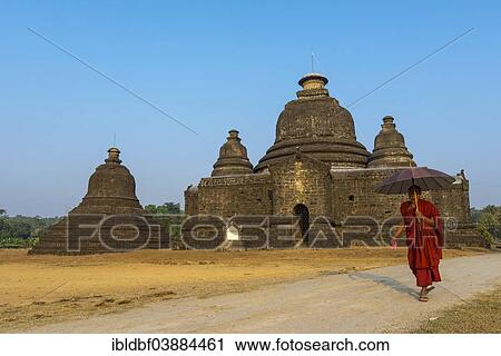 "Buddhist monk with a parasol, Laymyetnta Pagoda or temple, Mrauk U, Sittwe Division, Rakhine State, Myanmar, Asia" View Large Photo Image Stock Image - "Buddhist monk with a parasol, Laymyetnta Pagoda or temple, Mrauk U, Sittwe Division, Rakhine State, Myanmar, Asia". Fotosearch