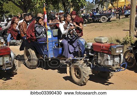 "Buddhist monks and villagers on the way home from the Full Moon Festival in December, Nyaung Shwe, Shan State, Myanmar, Burma, Asia" View Large Photo Image Stock Image - "Buddhist monks and villagers on the way home from the Full Moon Festival in December, Nyaung Shwe, Shan State, Myanmar, Burma, Asia". Fotosearch