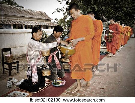 "Buddhist monks begging for alms in Luang Prabang, Laos, Southeast Asia, Asia" View Large Photo Image Stock Image - "Buddhist monks begging for alms in Luang Prabang, Laos, Southeast Asia, Asia". Fotosearch